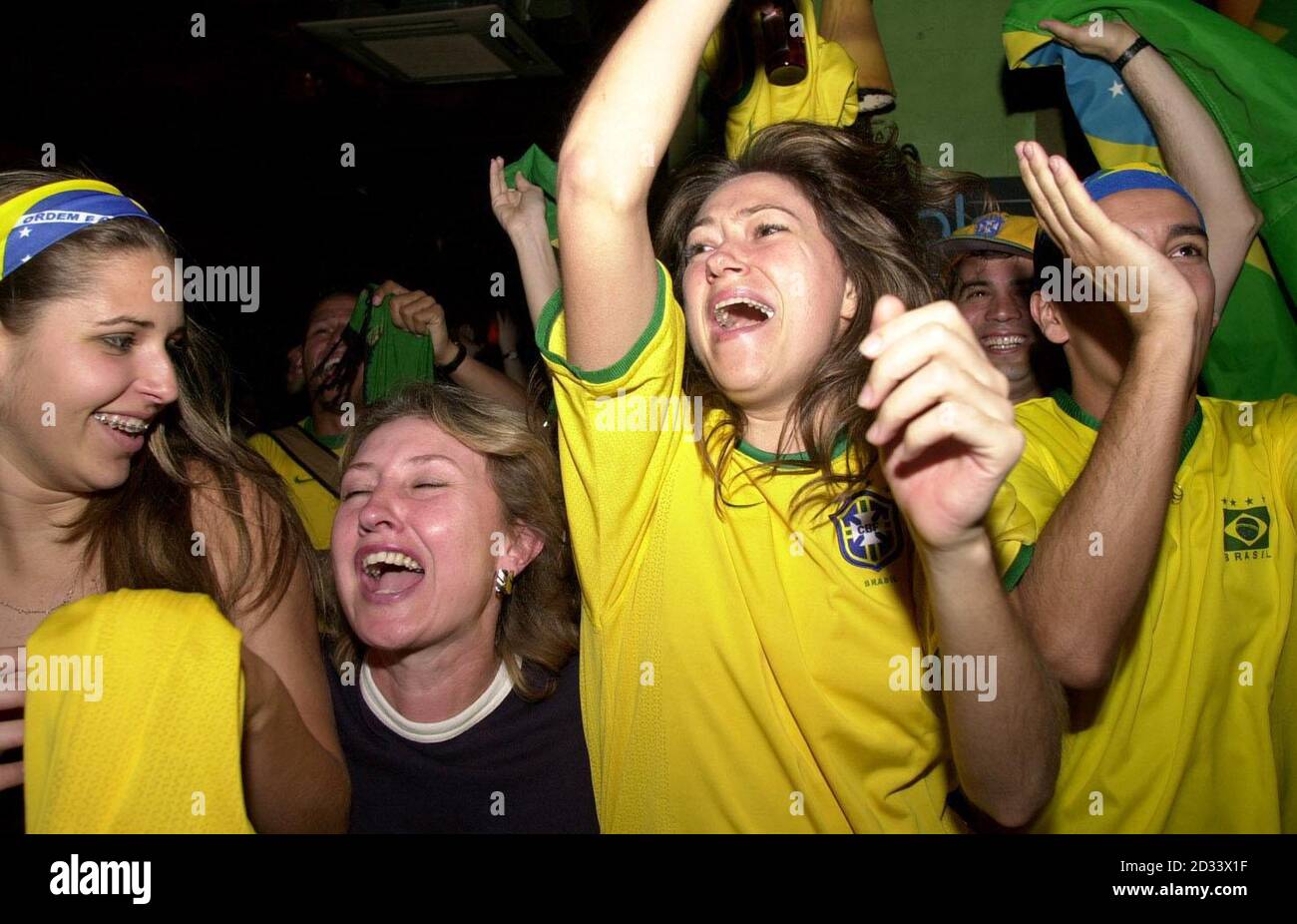 Brazilian football fans celebrate as their team beat Belgium to go 