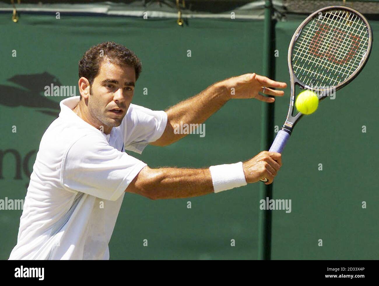 Seven times Wimbledon Champion Pete Sampras in action against the un-seeded Swiss tennis player George Bastl on Court Two at The All England Lawn Tennis Club. Stock Photo