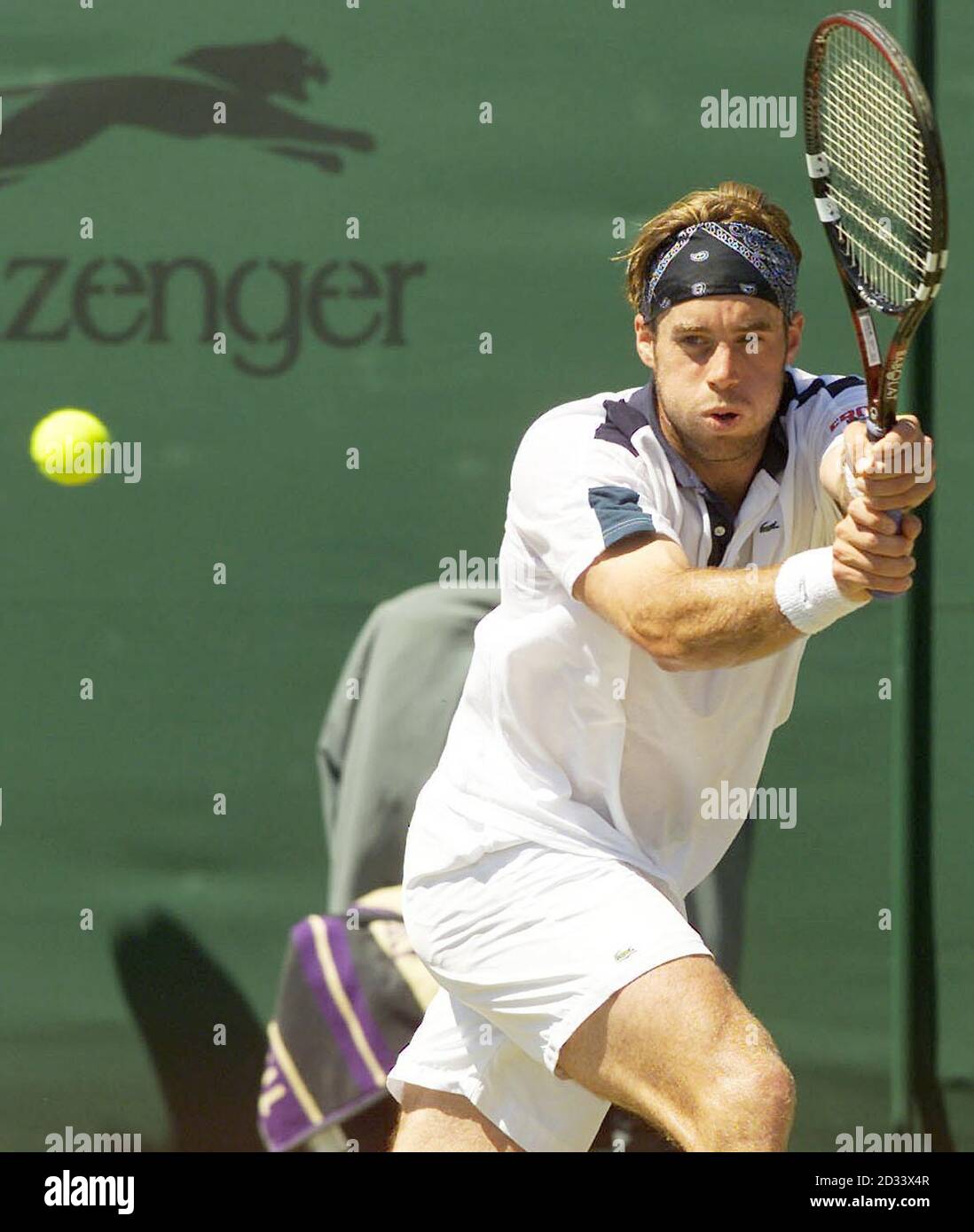 EDITORIAL USE ONLY, NO COMMERCIAL USE. Un-seeded Swiss tennis player George Bastl in action against seven times Wimbledon Champion Pete Sampras on Court Two at The All England Lawn Tennis Club. Stock Photo