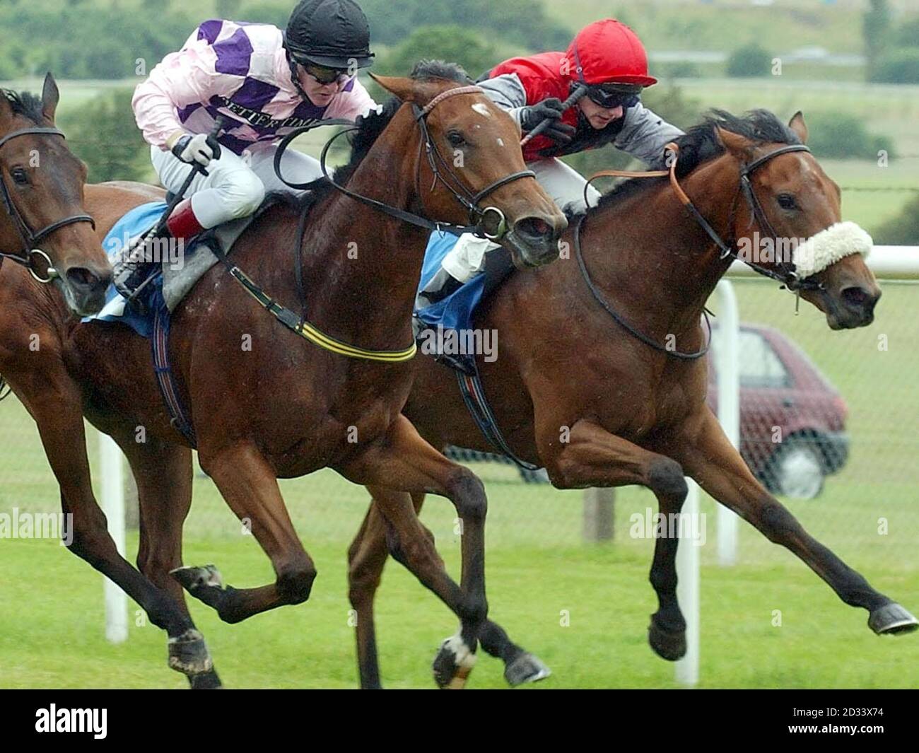 Miss Takeortwo with jockey Paul Hanagan (right) wins ahead of Victory Flip with jockey Graham Gibbons in the Irwins Maiden Auction Stakes at Pontefract Races. Stock Photo