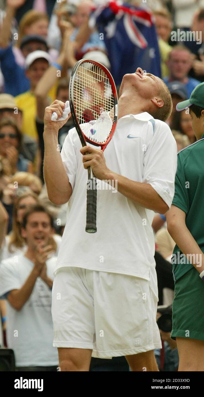 EDITORIAL USE ONLY, NO COMMERCIAL USE. The top seed Lleyton Hewitt from Australia celebrates after beating Sjeng Schalken from Holland in the mens' quarter final match on Court One at Wimbledon. *....The five set epic saw Hewitt lose a set for the first time in the tournament 6:2/6:2/7:6/1:6/7:5 Stock Photo