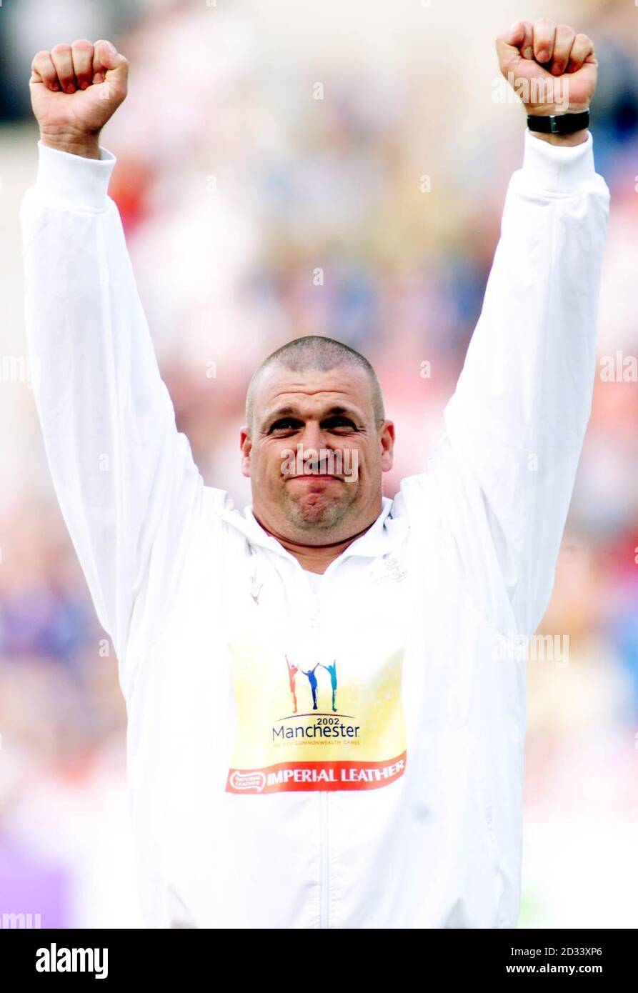 England's Mick Jones celebrates winning gold in the shotput, at the