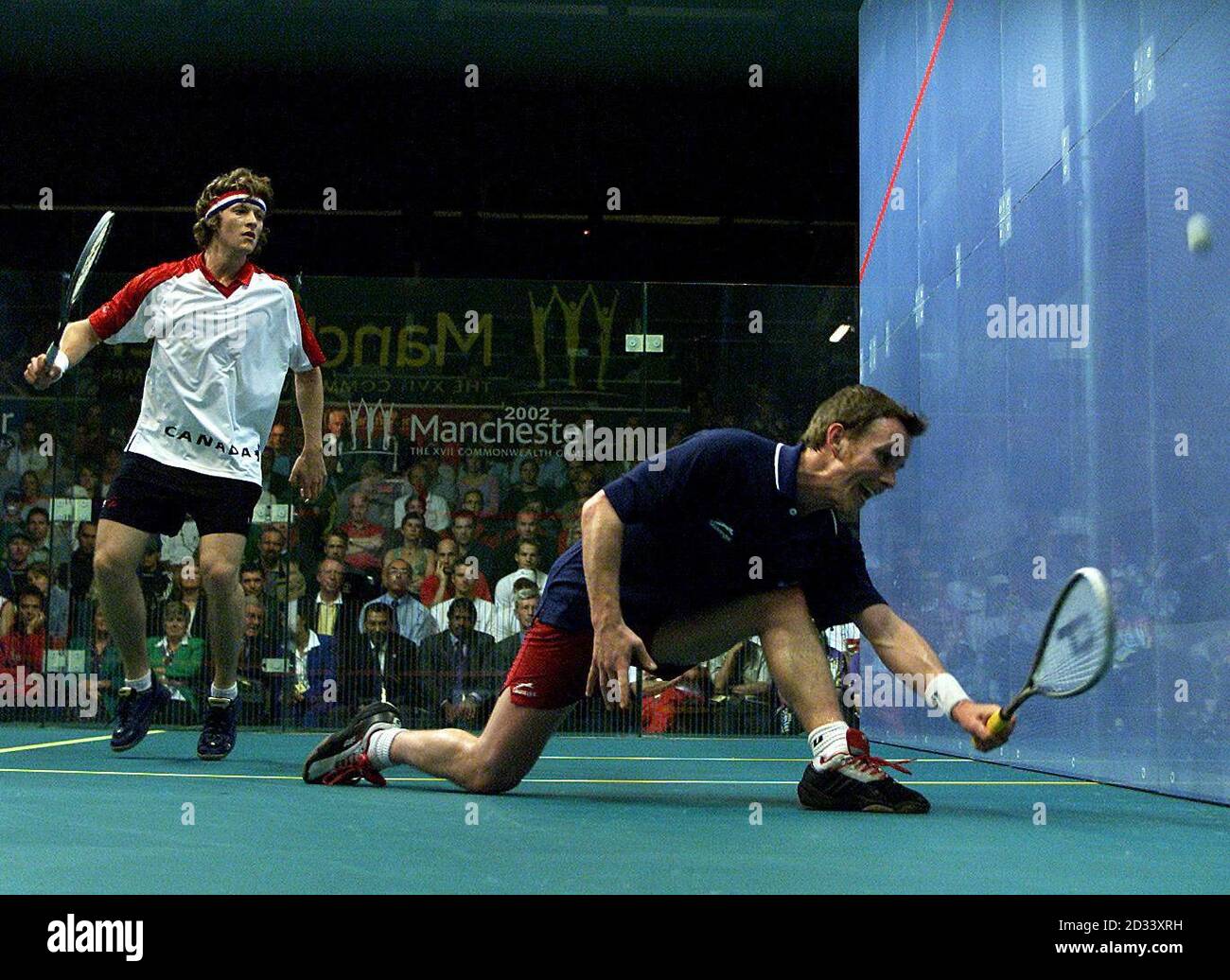 England's Peter Nicol (right) plays a forehand during his Mens Commonwealth  Singles Final versus Jonathon Power from Canada at National Squash Centre  in Manchester, Commonwealth Games Stock Photo - Alamy
