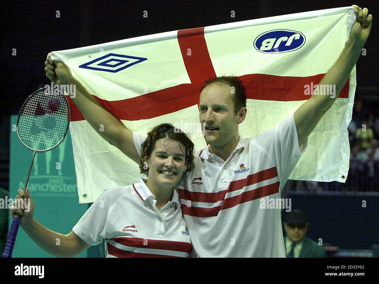 England's Simon Archer and Jo Goode celebrate winning the gold medal in badminton at the Bolton Arena, during the XVII Commonwealth Games. Stock Photo