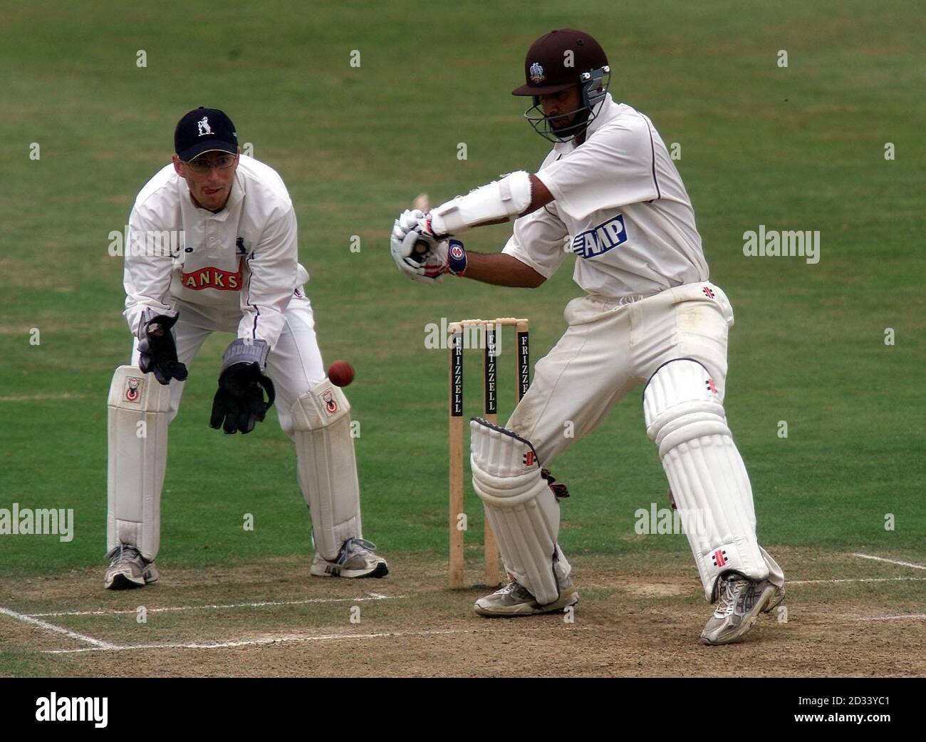 Surrey batsman Nadeem Shahid square cuts a delivery from Warwickshire's Ashley Giles during the Frizzell County Championship match at Edgbaston, Birmingham. Stock Photo