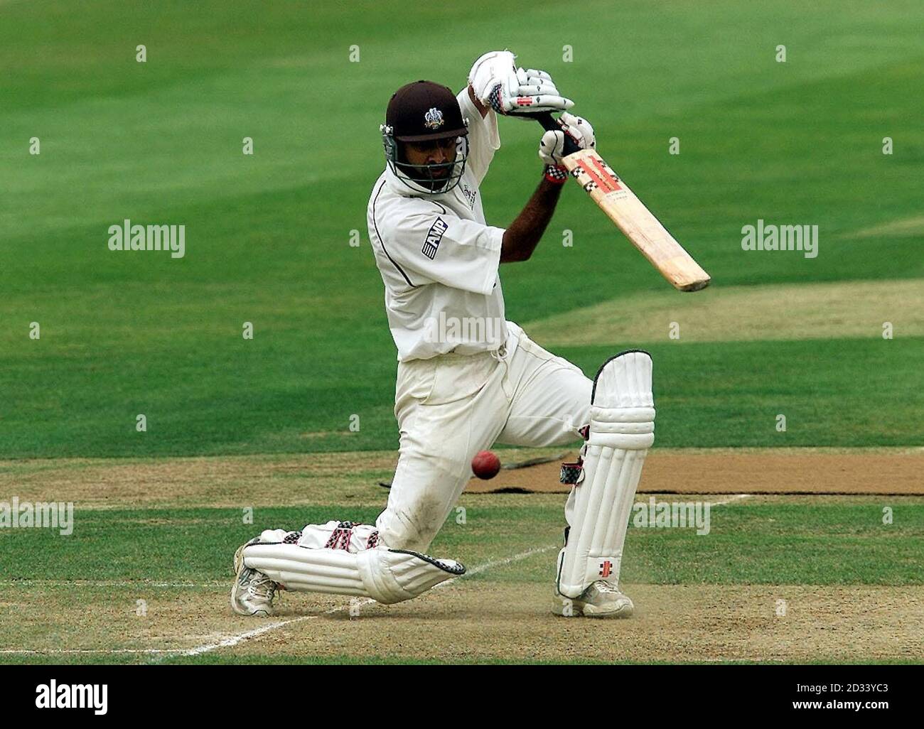 Surrey batsman Nadeem Shahid drives a delivery from Warwickshire's Melvyn Betts on his way to completing his half century during the Frizzell County Championship match at Edgbaston, Birmingham. Stock Photo