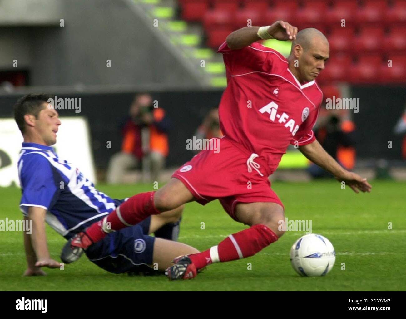 Aberdeen's Roberto Bisconti dribbles past Hertha Berlin's Pal Dardai in the first leg of their first round UEFA game at the Pittodrie stadium in Aberdeen. Stock Photo