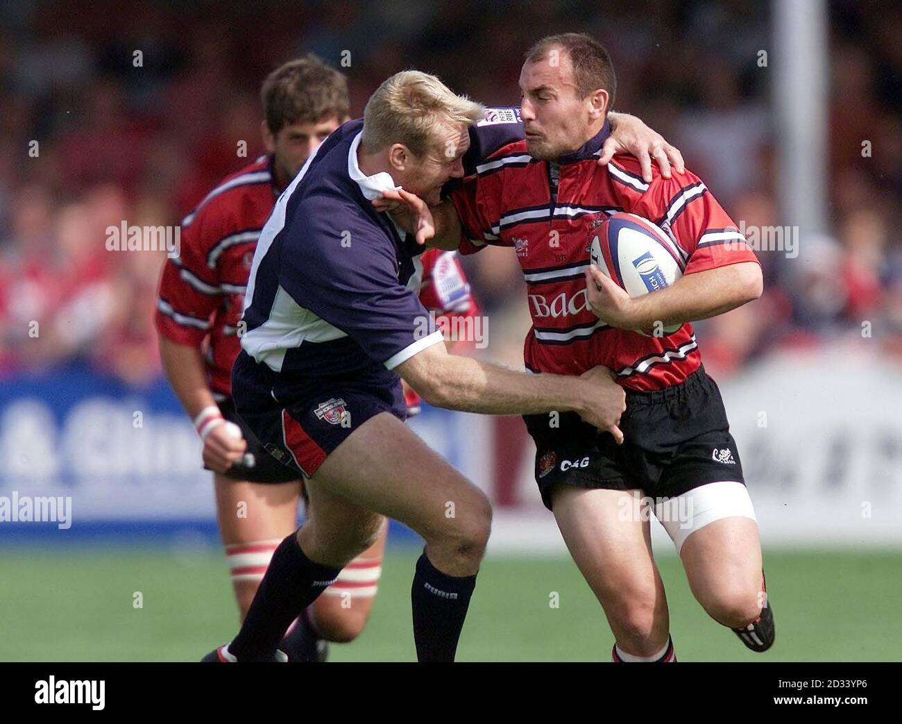 Ludovic Mercier (right) of Gloucester hands off Martin Shaw of Bristol during the Zurich Premiership match at Kingsholm, Gloucester. Stock Photo