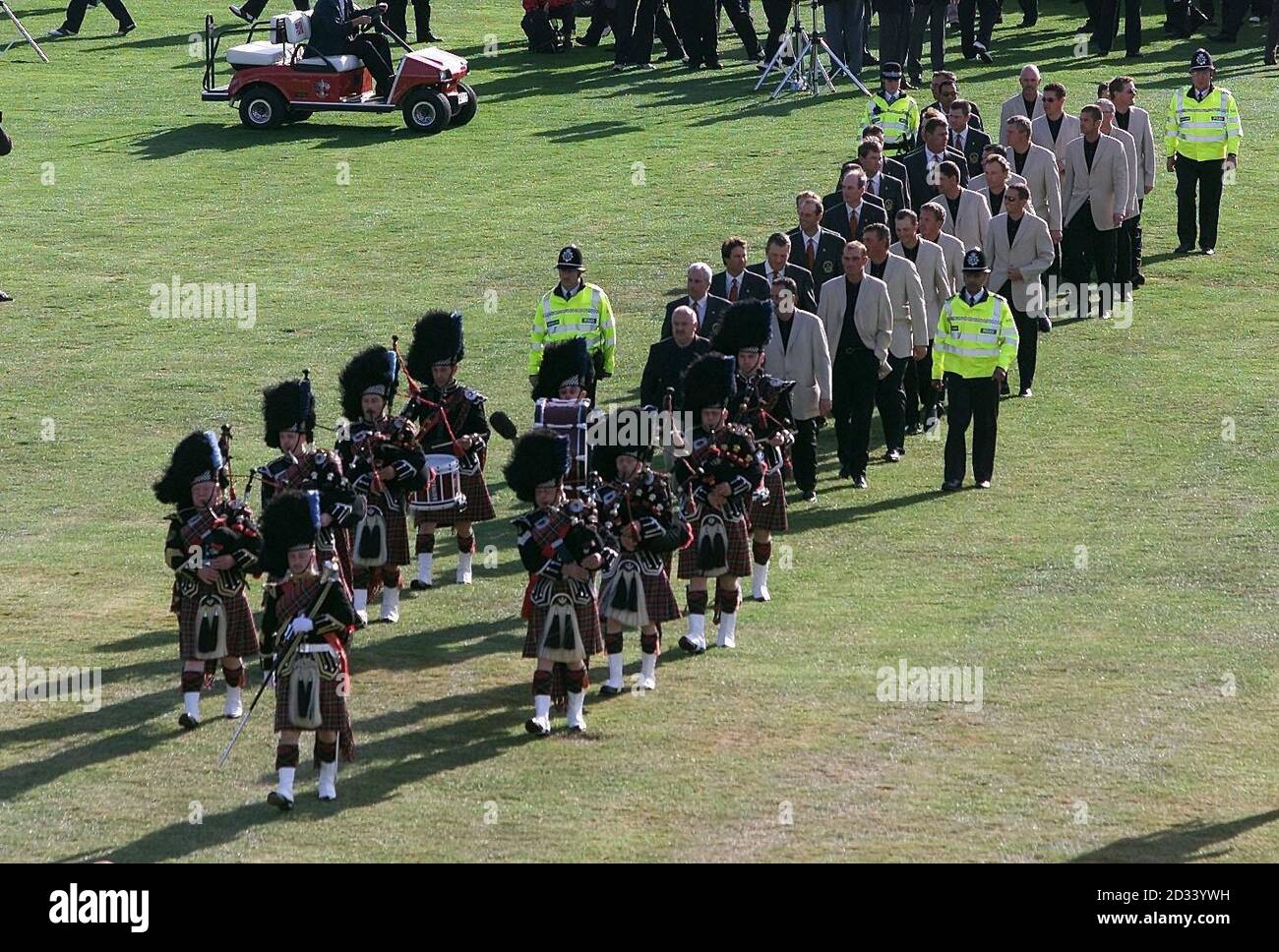 The Nottinghamshire Police Pipe Band lead the two Ryder Cup teams in for the opening ceremony (American's on left European's light tan jacket right). Stock Photo