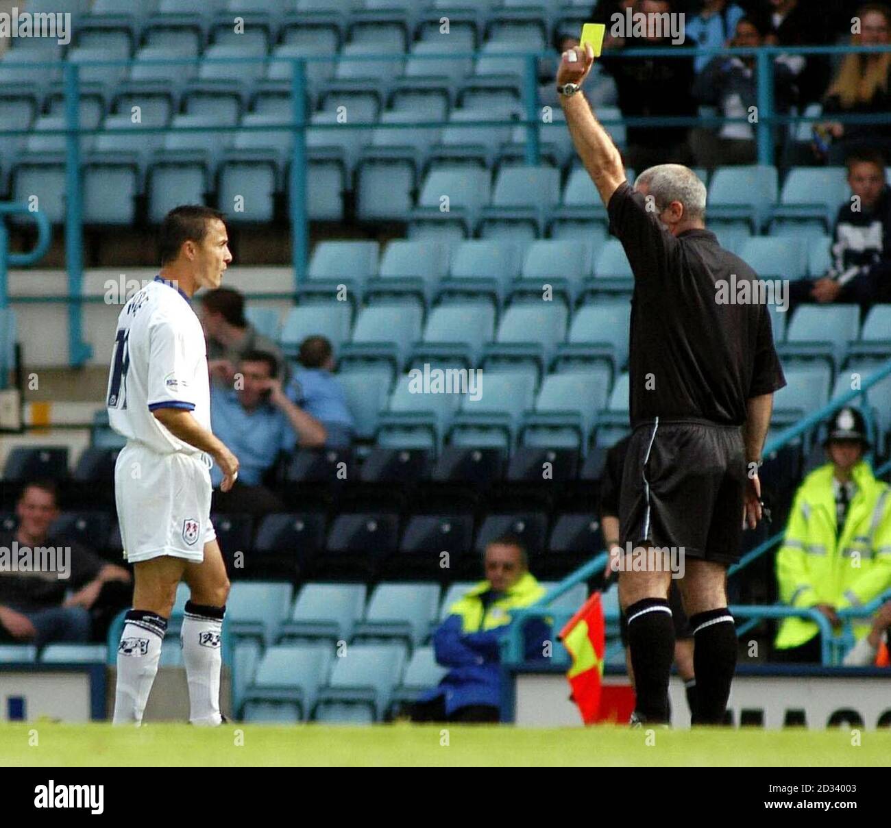 Millwall's Dennis Wise (left) receives a yellow card during the first-half of the Nationwide League Division One match against Coventry, at Coventry's Highfield Road Stadium. THIS PICTURE CAN ONLY BE USED WITHIN THE CONTEXT OF AN EDITORIAL FEATURE. NO UNOFFICIAL CLUB WEBSITE USE. Stock Photo