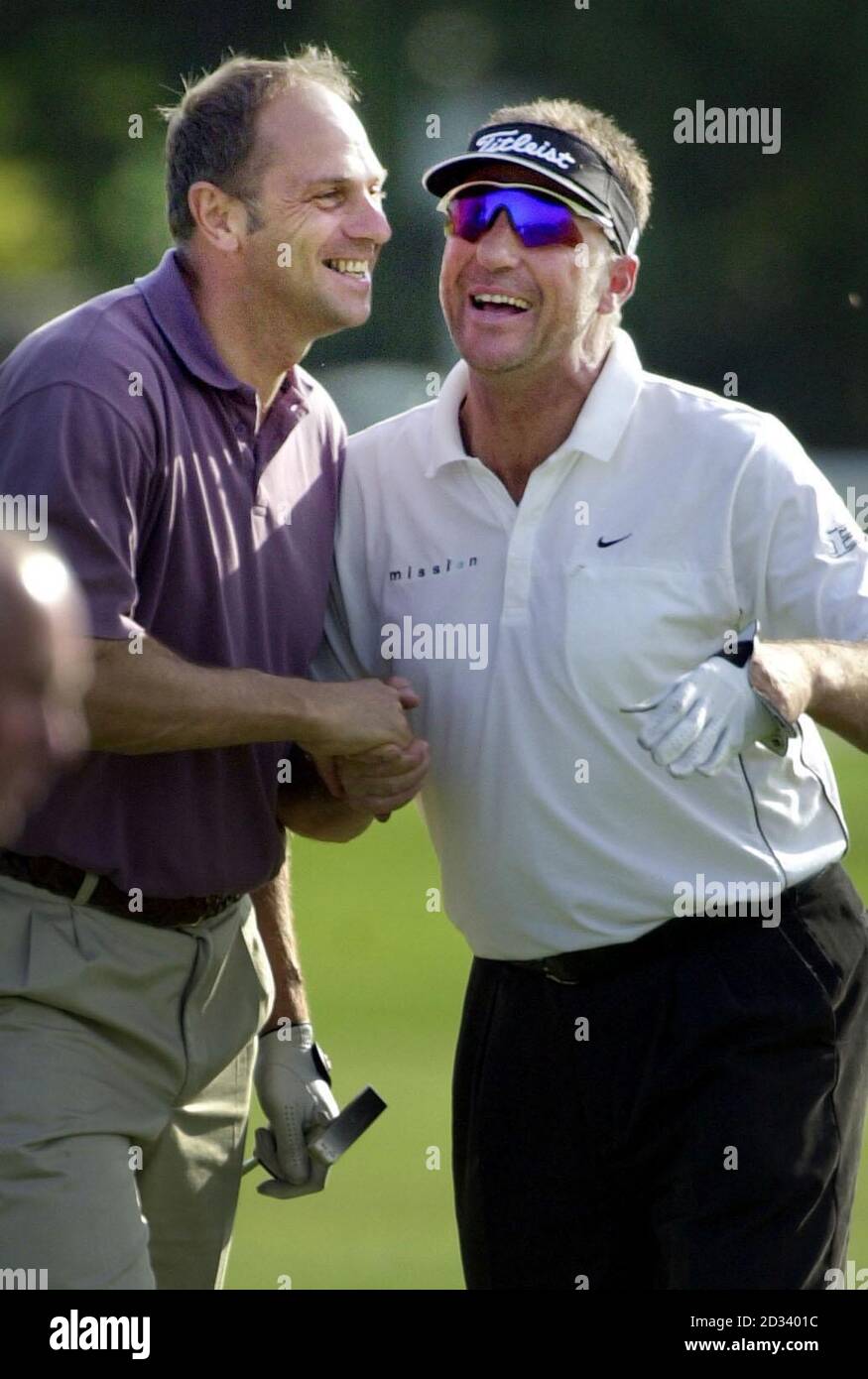 Olympic rowing gold medalist, Sir Steve Redgrave (left) shares a joke with former England cricketer, Ian Botham during a practice round for the 2002 Dunhill Links Championship at St Andrews, Scotland.   *  The tournament is played over three links courses in rotation,the Old course at St Andrews, the Championship course at Carnoustie,and the Kingsbarns links course. The tournament will be played from Thursday October 3rd. Stock Photo