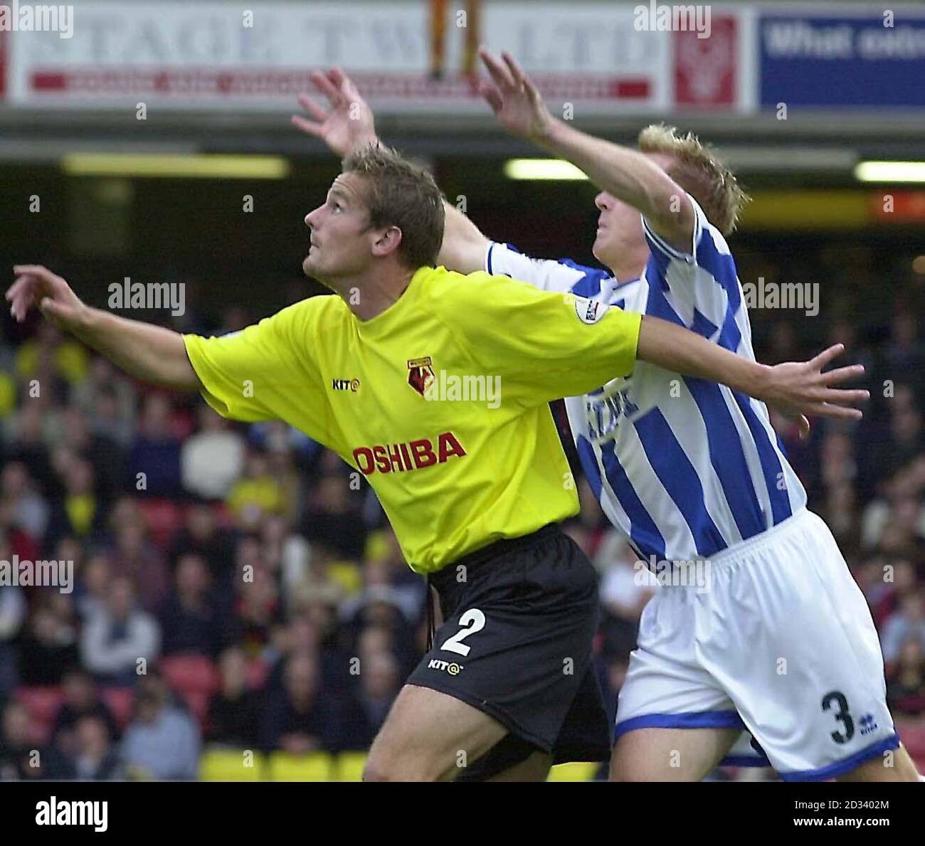 Watford's Neal Ardley (L) and Brighton's Kerry Mayo go for the high ball during their Nationwide Division One match at Watford's Vicarage Road ground. THIS PICTURE CAN ONLY BE USED WITHIN THE CONTEXT OF AN EDITORIAL FEATURE. NO UNOFFICIAL CLUB WEBSITE USE. Stock Photo