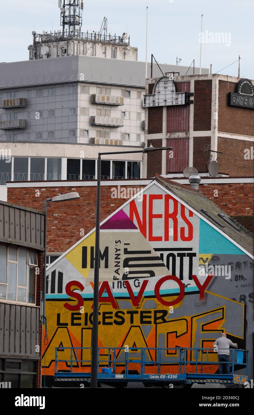 Leicester, Leicestershire, UK. 7th October 2020. An artist works on a street mural 100 days since the UKÕs first local coronavirus pandemic lockdown was announced in the city. Credit Darren Staples/Alamy Live News. Stock Photo