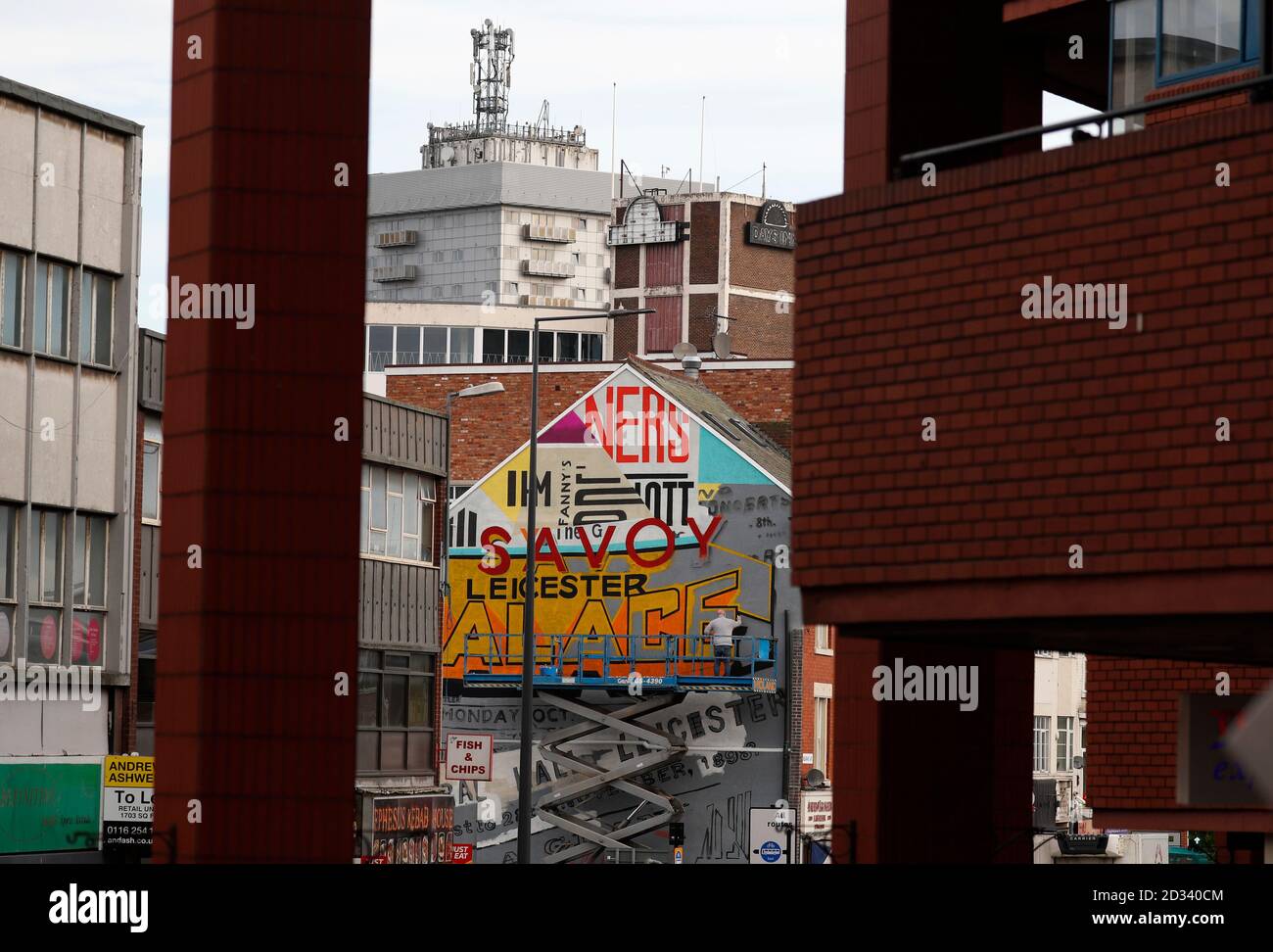 Leicester, Leicestershire, UK. 7th October 2020. An artist works on a street mural 100 days since the UKÕs first local coronavirus pandemic lockdown was announced in the city. Credit Darren Staples/Alamy Live News. Stock Photo
