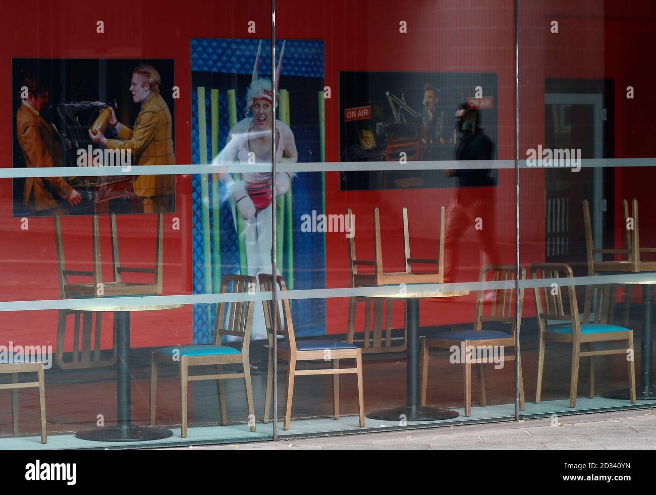 Leicester, Leicestershire, UK. 7th October 2020. A man is reflected in the window of the closed Curve Theatre 100 days since the UKÕs first local coronavirus pandemic lockdown was announced in the city. Credit Darren Staples/Alamy Live News. Stock Photo