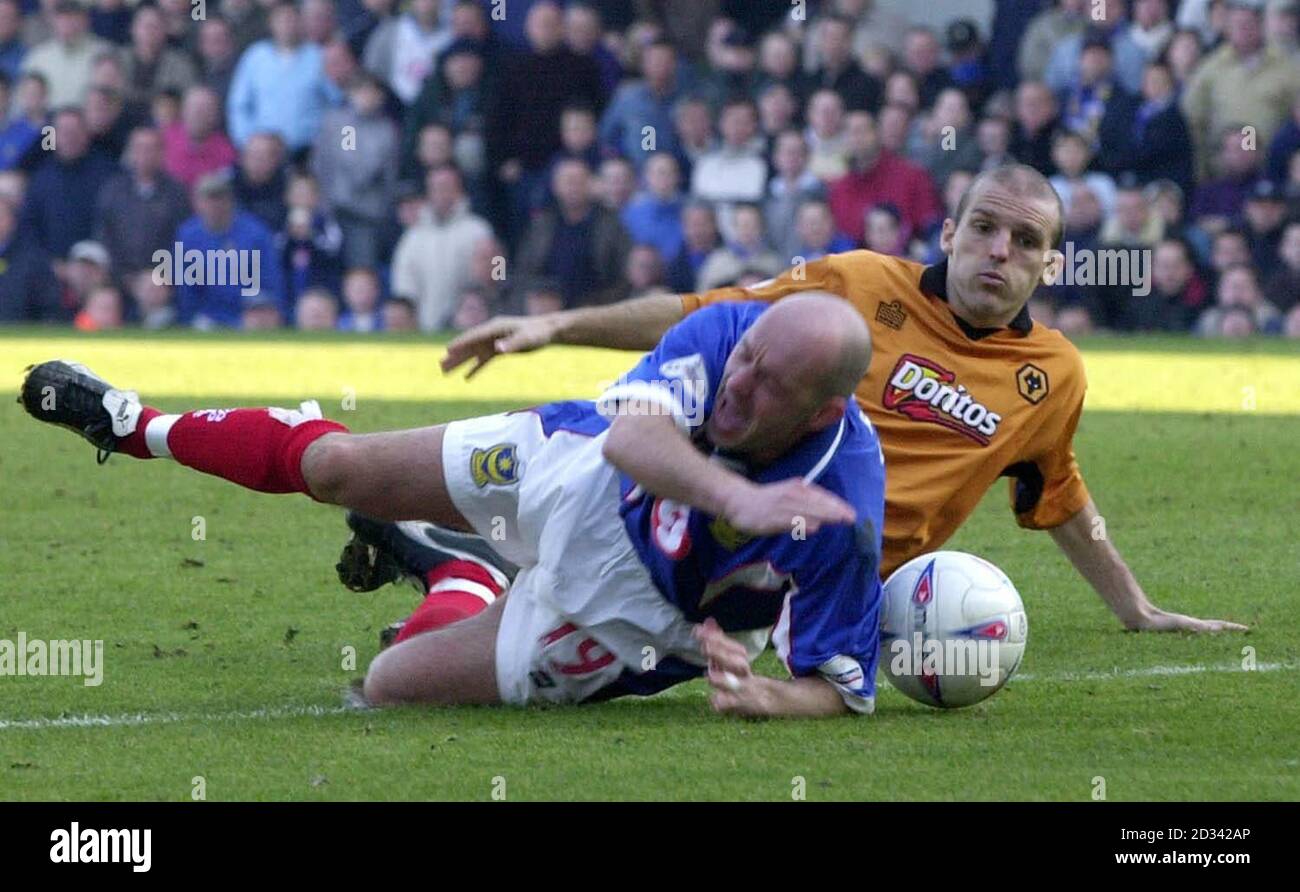 Portsmouth's Steve Stone is tackled by a Wolverhampton Wanderers' defender during the Nationwide Divison 1 match at Fratton Park, Portsmouth. THIS PICTURE CAN ONLY BE USED WITHIN THE CONTEXT OF AN EDITORIAL FEATURE. NO UNOFFICIAL CLUB WEBSITE USE. Stock Photo