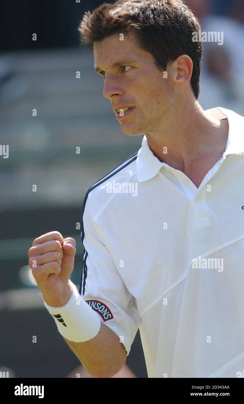 EDITORIAL USE ONLY, NO MOBILE PHONE USE. British tennis star Tim Henman celebrates beating Tomas Zib of the Czech Republic 6-2, 7-6, 3-6, 6-1 on Court One at the All England Lawn Tennis Championships in Wimbledon. Stock Photo