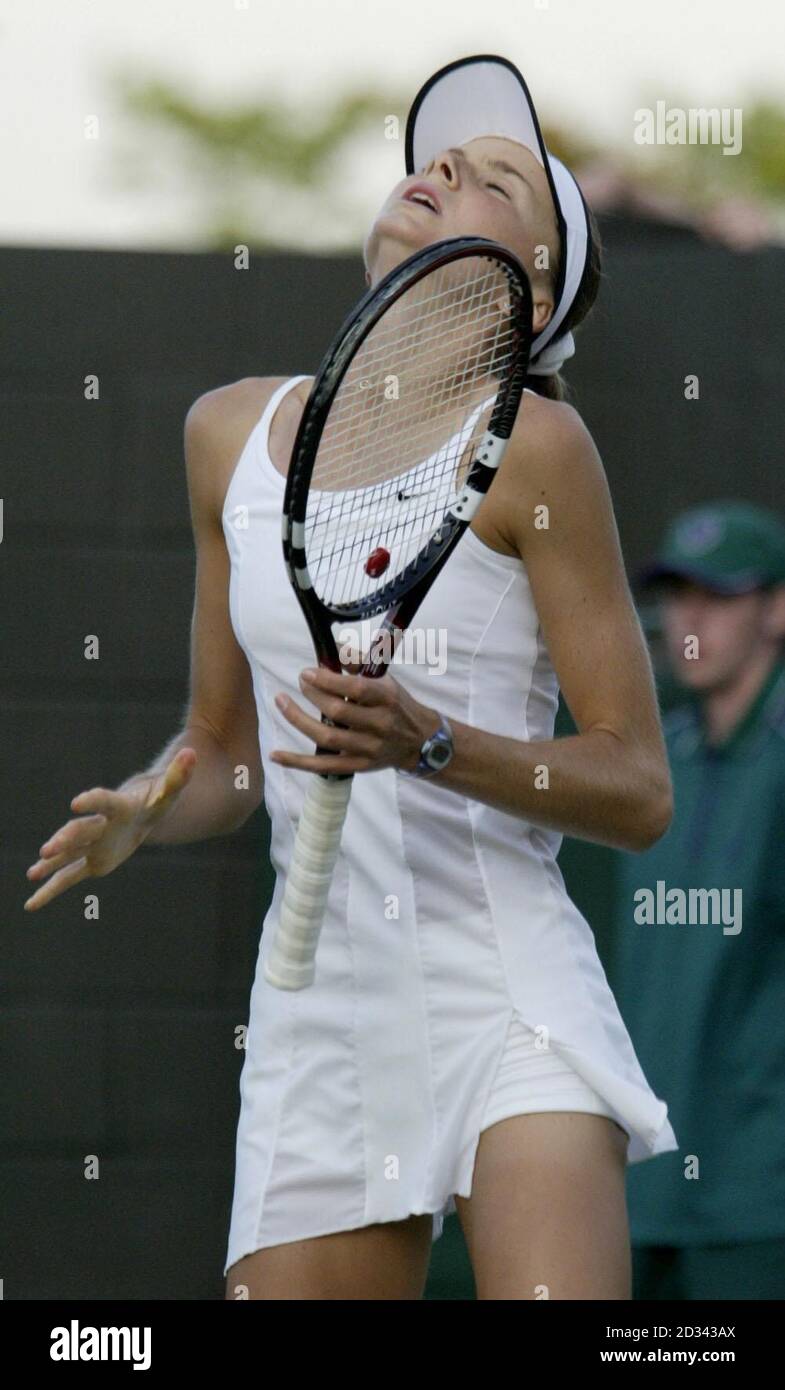 EDITORIAL USE ONLY, NOT FOR USE ON MOBILE PHONES Daniela Hantuchova from Slovakia crashes out of the second round to Shinobu Asagoe from Japan at the All England Lawn Tennis Championships in Wimbledon. Asagoe took the match to three sets 0:6/6:4/12:10.  Stock Photo
