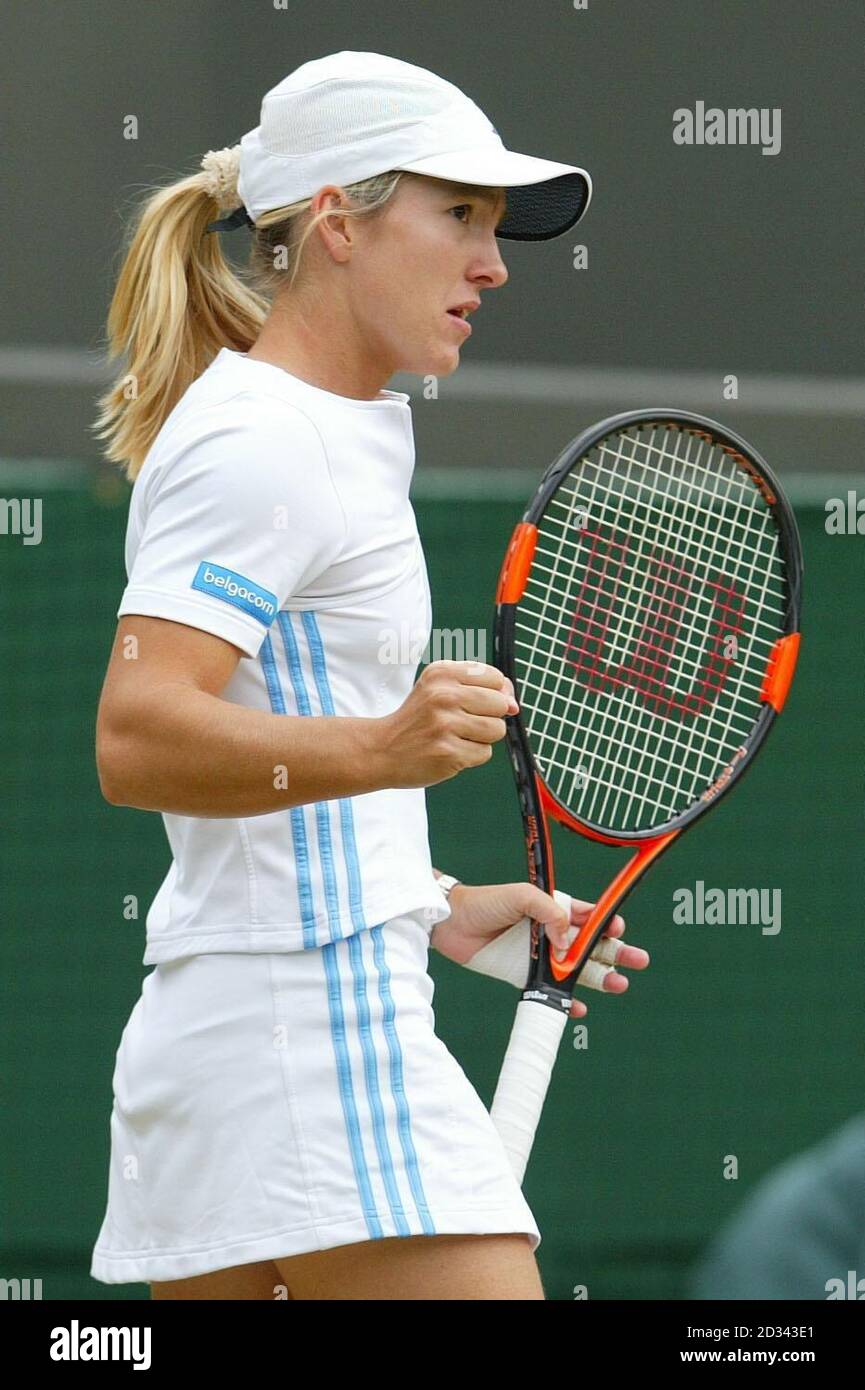 EDITORIAL USE ONLY, NO MOBILE PHONE USE :  Justine Henin-Hardenne from Belgium in action against Svetlana Kuznetsova from Russia in the ladies quarter finals at the All England Lawn Tennis Championships at Wimbledon.  Stock Photo