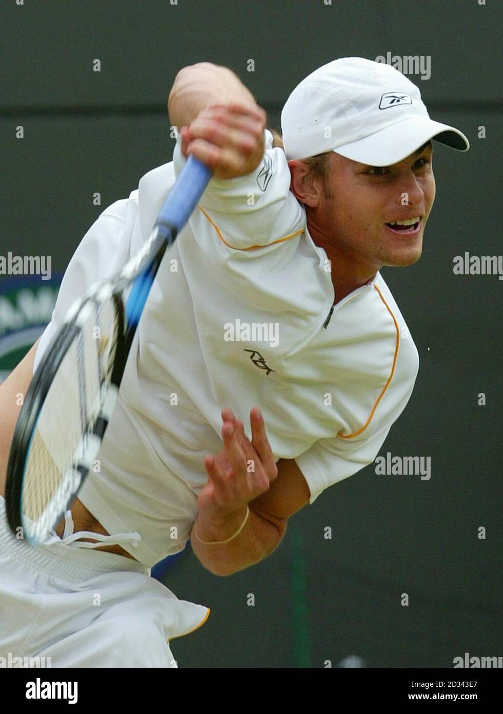 EDITORIAL USE ONLY, NO MOBILE PHONE USE. Andy Roddick from the USA in action against Jonas Bjorkman from Sweden during their quarter-final match at the All England Lawn Tennis Championships at Wimbledon. Stock Photo