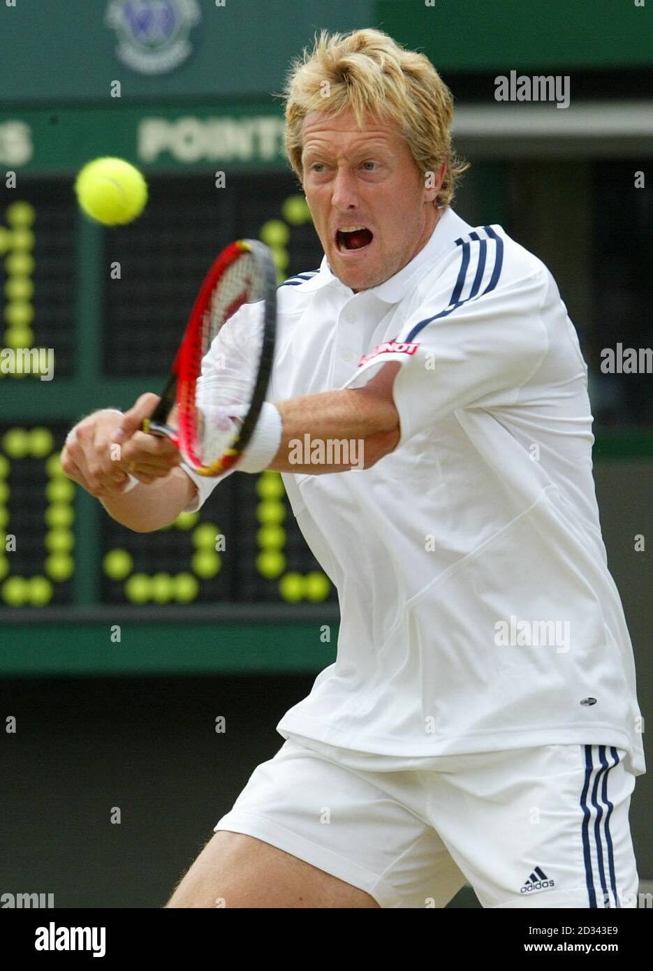 Jonas Bjorkman from Sweden in action against Andy Roddick from the USA during their quarter-final match at the All England Lawn Tennis Championships at Wimbledon. Stock Photo