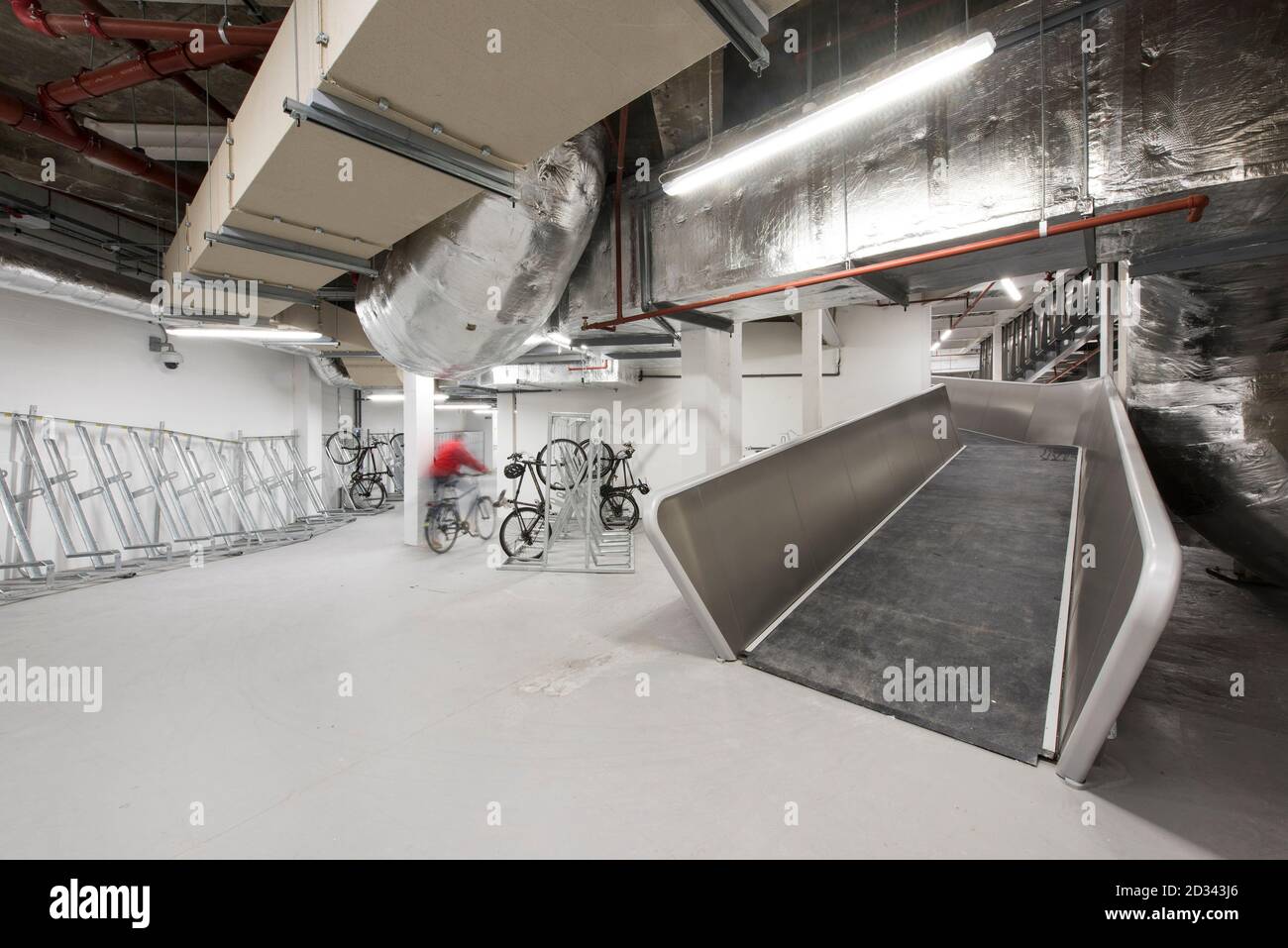 Underground cycle ramp leading to cycle parking facilities. Verde SW1, London, United Kingdom. Architect: Aukett Swanke & Adjaye Associates, 2016. Stock Photo