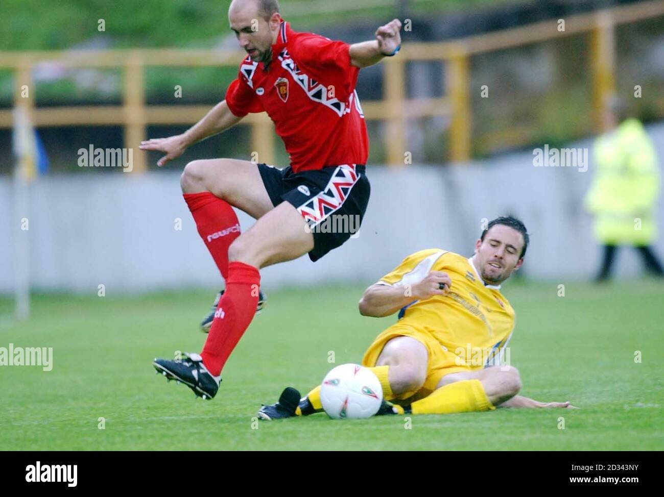 Barry's Jon French tackles an airbourne Jovica Travajcev of FK Vardar, at Jenner Park. THIS PICTURE CAN ONLY BE USED WITHIN THE CONTEXT OF AN EDITORIAL FEATURE. NO UNOFFICIAL CLUB WEBSITE USE. Stock Photo