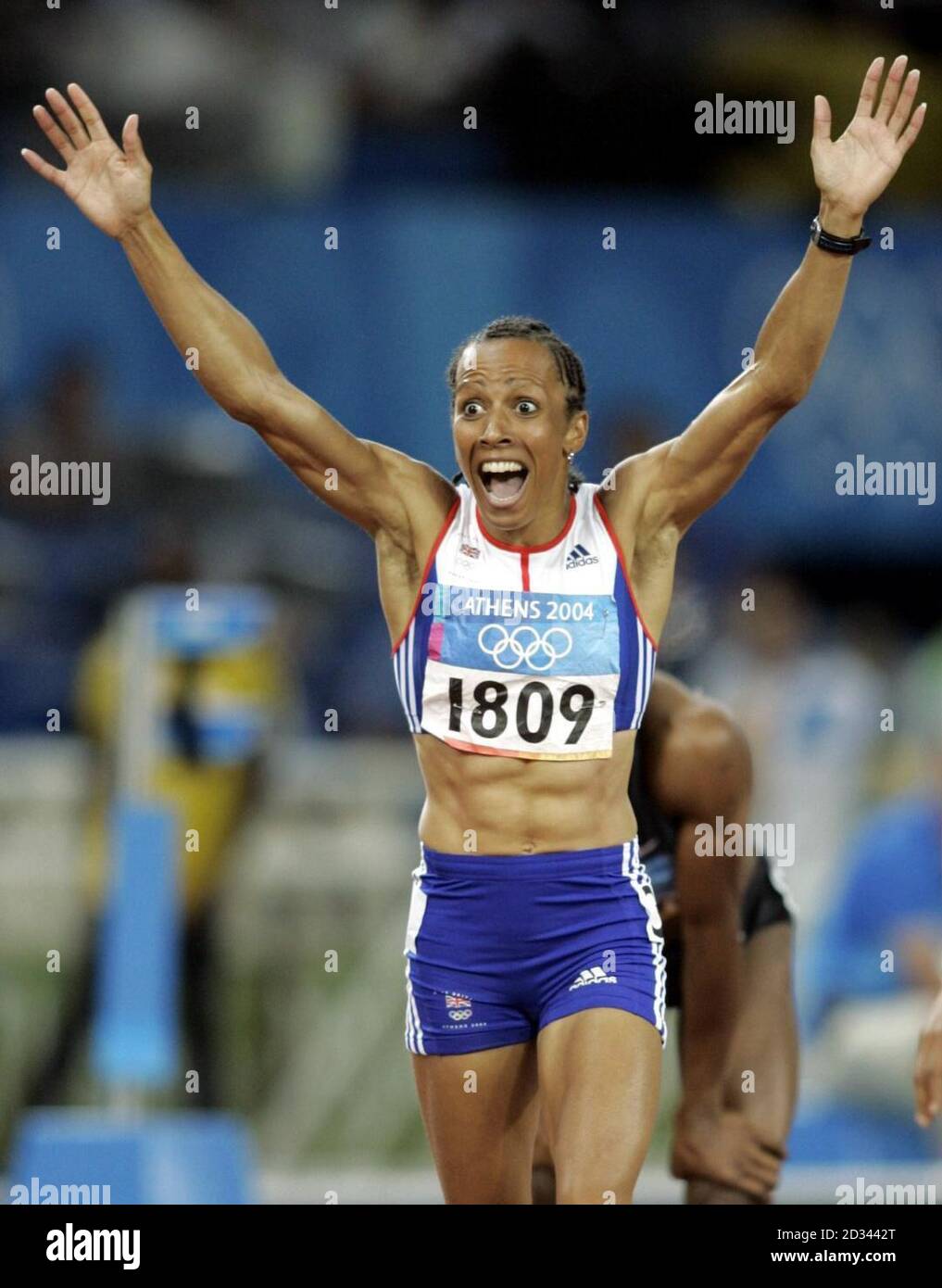 Great Britain's gold medal winner Kelly Holmes celebrates after winning the Women's 800m at the Olympic Stadium during the Olympic Games in Athens, Greece. Stock Photo