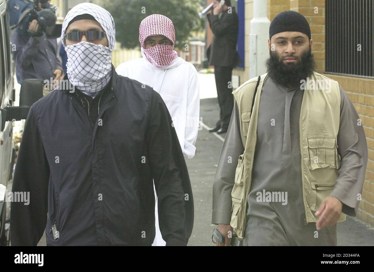 Supporters of muslim extremist group, Al-Muhajiroun, in east London, after attending a news conference held by the group hailing the US September 11th attacks three years ago today. Stock Photo