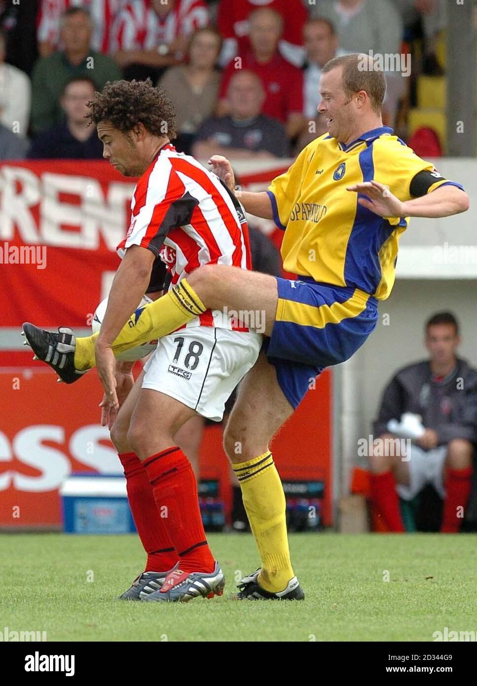 Craig Taylor of Torquay (R) battles with Brentford's Deon Burton during their Coca Cola League One match at Plainmoor, Torquay. Stock Photo