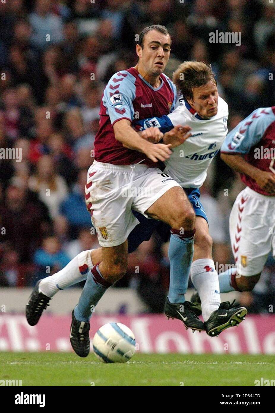 Aston Villa's Gavin McCann (left) muscles Crystal Palace's Joonas Kolkka during the Barclaycard Premiership match at Villa Park, Birmingham.  THIS PICTURE CAN ONLY BE USED WITHIN THE CONTEXT OF AN EDITORIAL FEATURE. NO WEBSITE/INTERNET USE UNLESS SITE IS REGISTERED WITH FOOTBALL ASSOCIATION PREMIER LEAGUE. Stock Photo