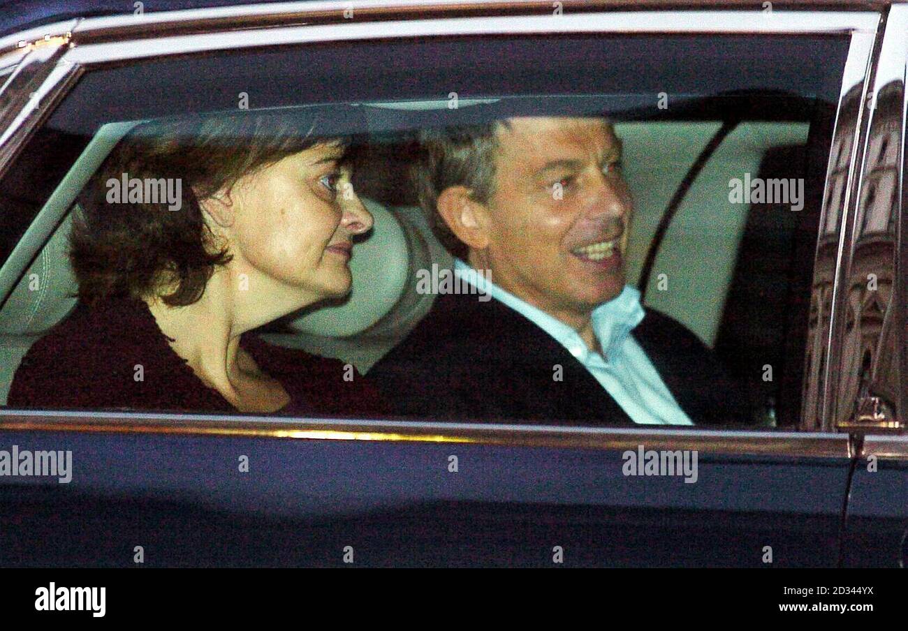 British Prime Minister Tony Blair leaves Downing Street accompanied by his wife Cherie, to undergo treatment for a recurring heart condition. The 51-year-old Prime Minister said Thursday that he would serve a full third term, if elected, and then stand down. Stock Photo