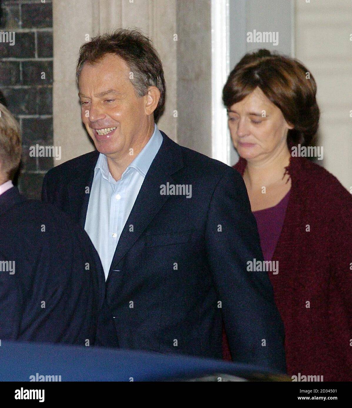 British Prime Minister Tony Blair leaves Downing Street  accompanied by his wife Cherie, to undergo treatment for a recurring heart condition. The 51-year-old Prime Minister said Thursday that he would serve a full third term, if elected, and then stand down.  Stock Photo