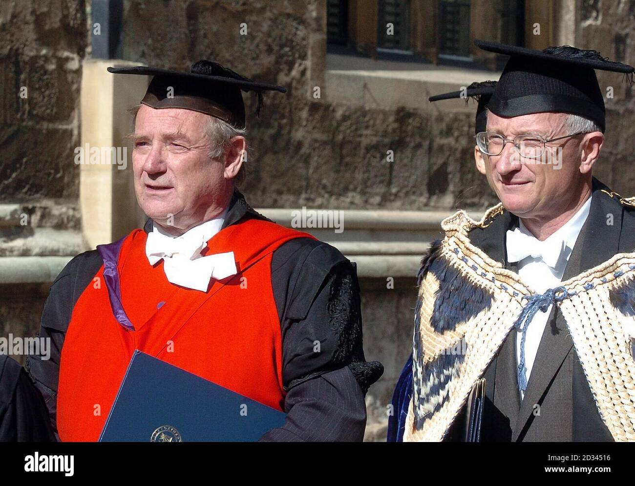 The new Vice-Chancellor of Oxford University Dr John Hood (right) and the outgoing Vice-Chancellor Sir Colin Lucas lead the procession from Old Clarendon Building to the University Church of St Mary the Virgin for the admission ceremony in front of the varsity's 'parliament of dons'. A former adviser to the New Zealand cricket squad, Dr Hood is the 270th individual and the first outside candidate to hold the post an and the 270th. Stock Photo