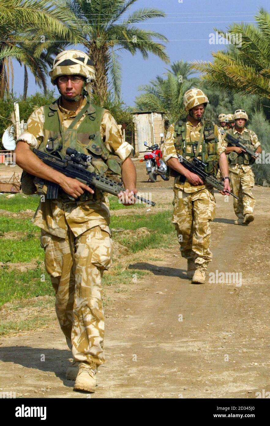 Soldiers from A company of the 1st Battalion Black Watch on community patrol through the area of Ahmed Al Ahamadi near Camp Dogwood, Iraq. Three Black watch soldier died in a suicide attack at a vehicle checkpoint yesterday. The bodies of the dead men were due to be flown to Basra airport later today for a repatriation ceremony before being returned to the UK and their families next week. Stock Photo