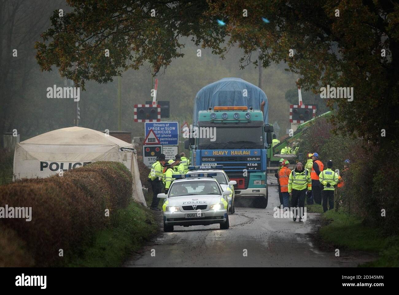 A lorry carries away part of the wreckage from last Saturday's train crash which occurred when a car came to a halt on a level crossing causing the oncoming train to smash into it and derail shortly afterwards at Ufton Nervet in Berkshire. The crash, which has claimed seven lives, happened on Saturday evening after the train had left Reading bound for Plymouth. Stock Photo