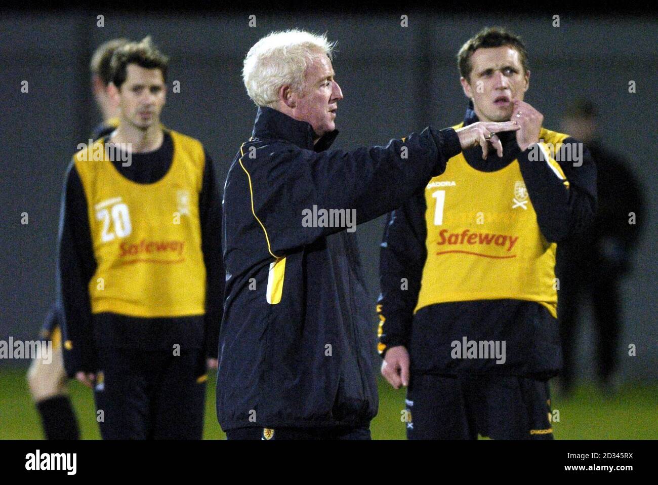 Scotland's caretaker manager Tommy Burns (centre) takes training watched by Jackie McNamara (left) and Scott Severin  (right) during a training session at the Strathclyde Homes Stadium in Dumbarton before their International friendly against Sweden this Wednesday.   EDITORIAL USE ONLY Stock Photo