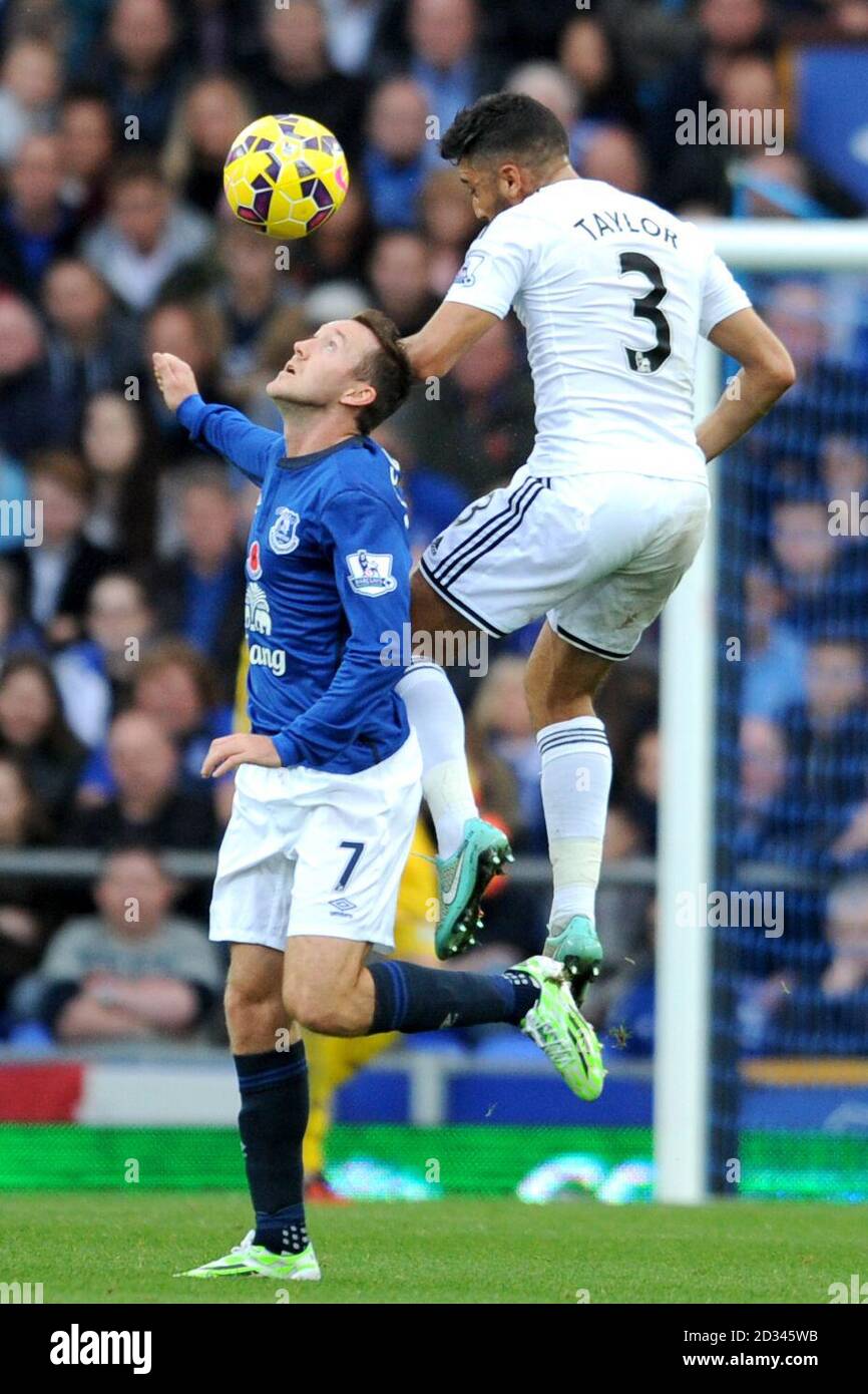 Everton's Aidan McGeady (right) and Swansea City's Neil Taylor battle for the ball during the Barclays Premier League match at Goodison Park, Liverpool. PRESS ASSOCIATION Photo. Picture date: Saturday November 1st, 2014. See PA story SOCCER Everton. Photo credit should read Jon Buckle/PA Wire. Editorial use only. Maximum 45 images during a match. No video emulation or promotion as 'live'. No use in games, competitions, merchandise, betting or single club/player services. No use with unofficial audio, video, data, fixtures or club/league logos. Stock Photo