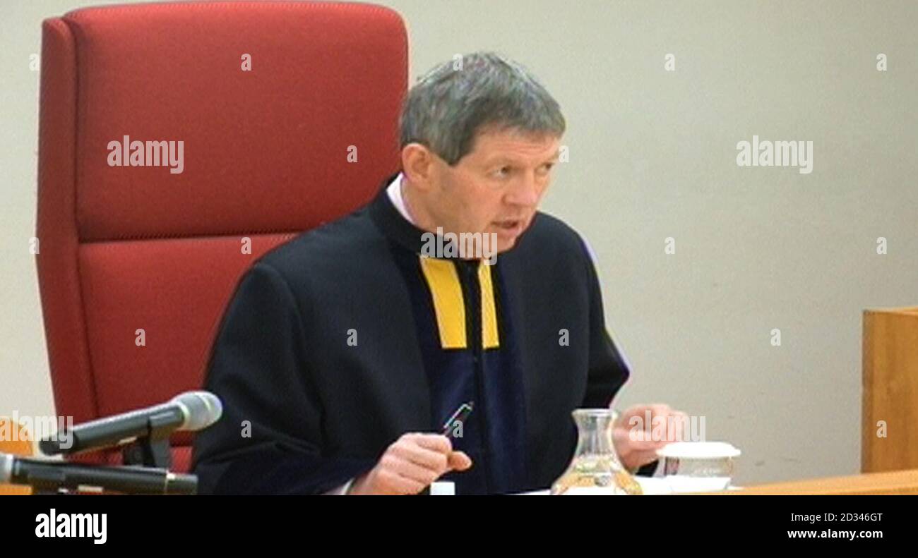 A still taken from a video feed of the filming of Lord Justice Treacy in the Court of Appeal, London, as he ruled a young child is not entitled to criminal injuries compensation after her mother drank excessively while pregnant. Stock Photo
