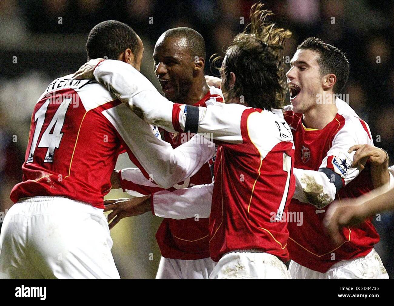 Arsenal's Patrick Vieira (second left) celebrates scoring the opening goal against Newcastle United with team-mates Thierry Henry (left) and Robert Pires (second right) THIS PICTURE CAN ONLY BE USED WITHIN THE CONTEXT OF AN EDITORIAL FEATURE. NO WEBSITE/INTERNET USE UNLESS SITE IS REGISTERED WITH FOOTBALL ASSOCIATION PREMIER LEAGUE. Stock Photo