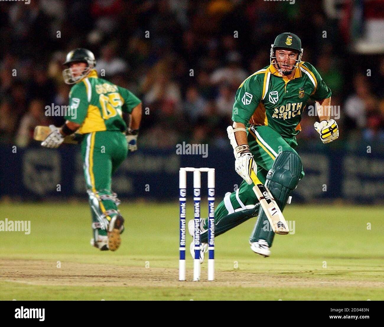 South Africa captain Graeme Smith (right) runs between the wickets with batting partner herschelle Gibbs. Stock Photo