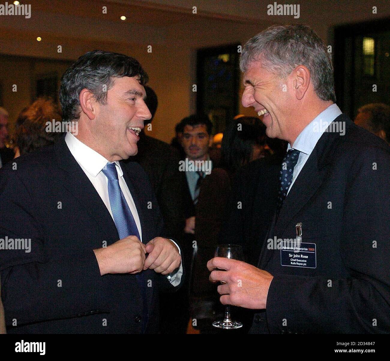 Chancellor Gordon brown speaks with Sir John Rose, chief executive of Rolls  Royce Stock Photo - Alamy