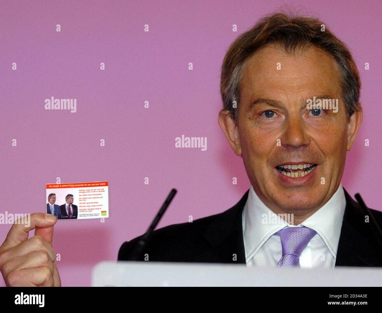 Tony Blair holds an economy pledge card Stock Photo - Alamy