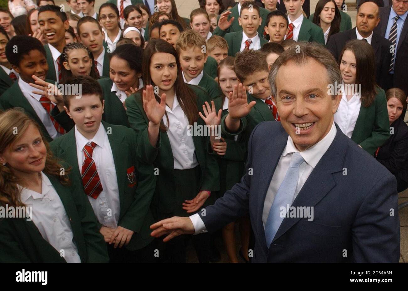 Politics education posing with children tony blair hi-res stock
