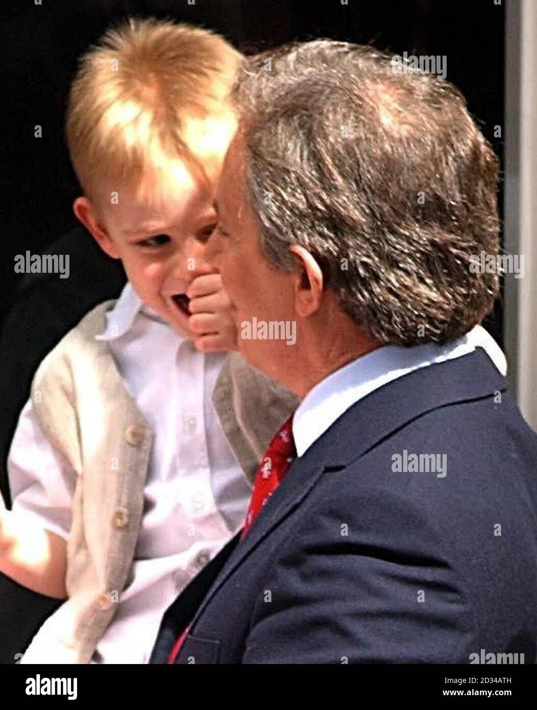 British Prime Minister Tony Blair poses with his youngest son Leo in