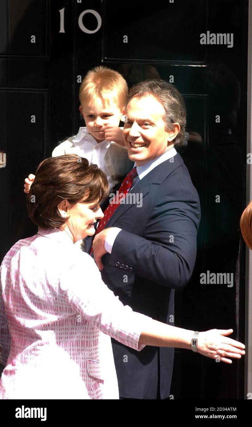 Britain's Prime Minister Tony Blair holds youngest son Leo with wife