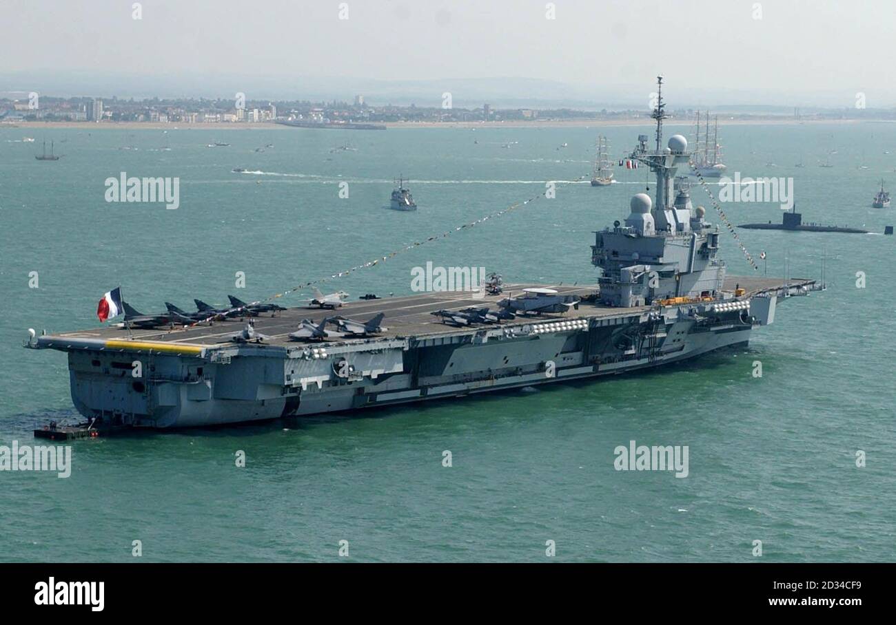 The French aircraft carrier the Charles de Gaulle sits surrounded by ...