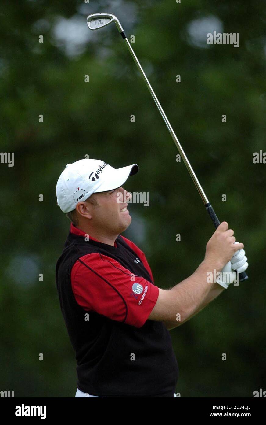 England's Graeme Storm plays his approach shot to the seventh hole during the final round. Stock Photo