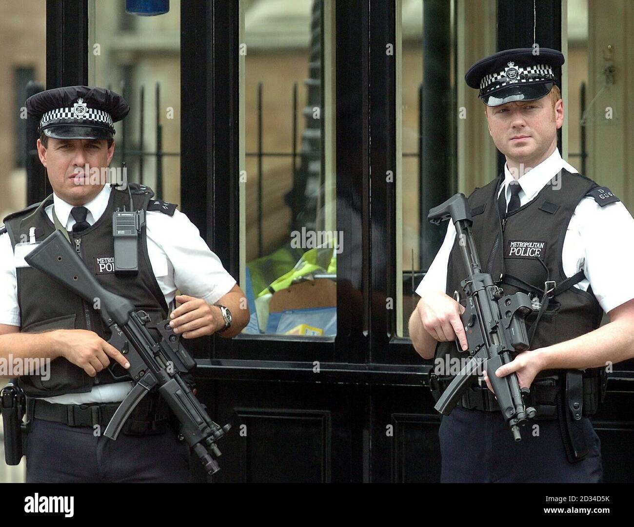 Armed Police officers in Westminster. Britain's most senior police officer today defended the specialist firearms officers who who shot dead an innocent Brazilian man they had mistaken for a suicide bomber. Metropolitan Police Commissioner Sir Ian Blair said the officers who shot Jean Charles de Menezes at Stockwell Tube station last week would have thought they faced the risk of 'certain death'. They 'clearly thought' they were dealing with a suicide bomber, and yet they still ran towards him, he said. Stock Photo