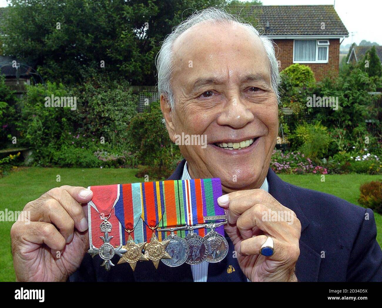 Major Neville Hogan 84 a former Chindit soldier in Burma shows off his medals at his home in Hemel Hempstead Hertfordshire. Burmese born Hogan was just 16 years old when he borrowed his brother s birt...